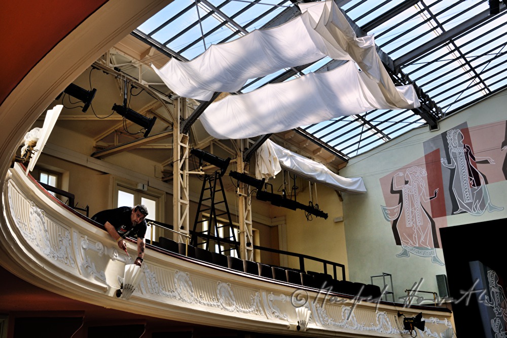 lighting technician sets the spotlights