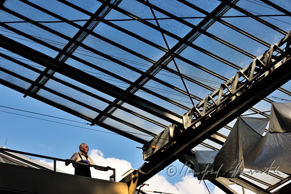 company technician near the openable glass roof and a white curtain