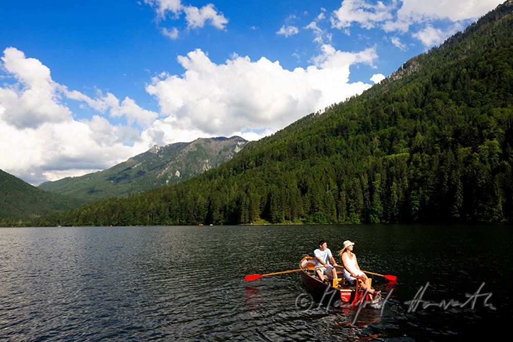 a couple takes a trip in a rowing boat