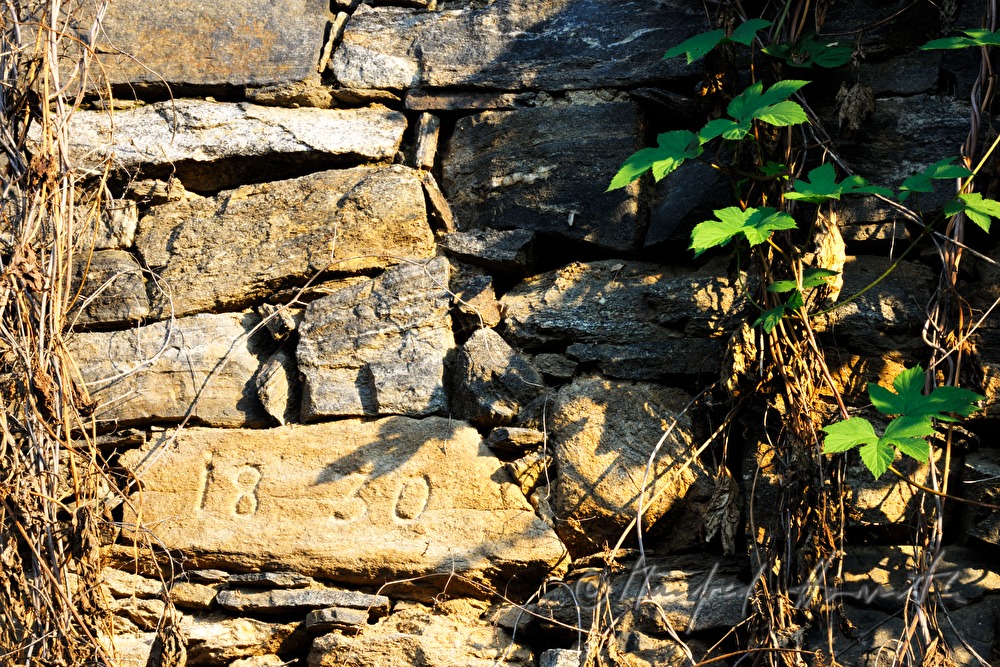 dry stone wall with the year 