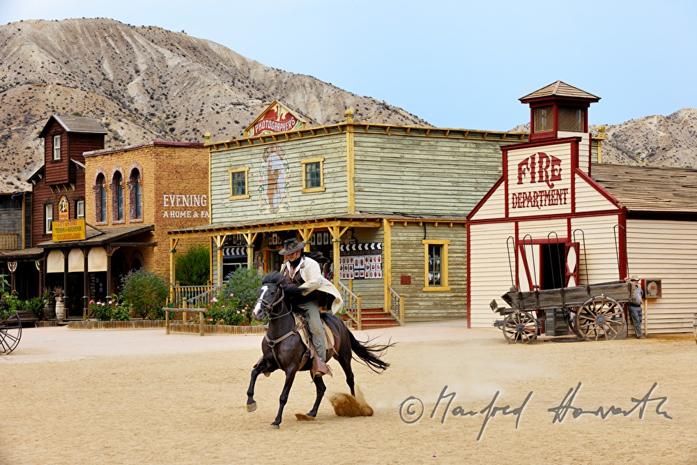 western performer rides cross the sqare