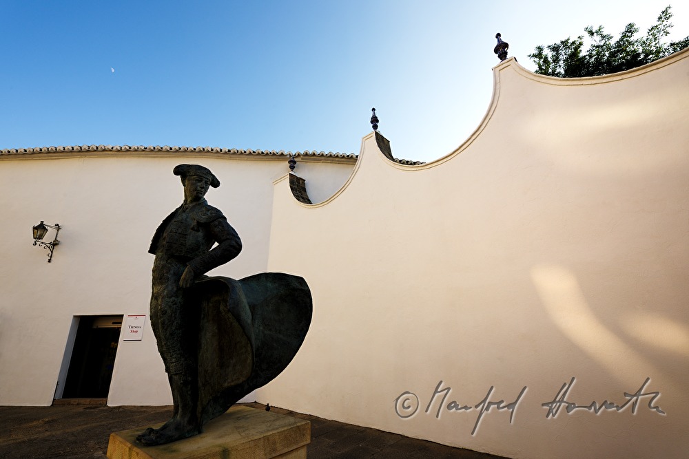 bullfighting arena and sculpture of a torero