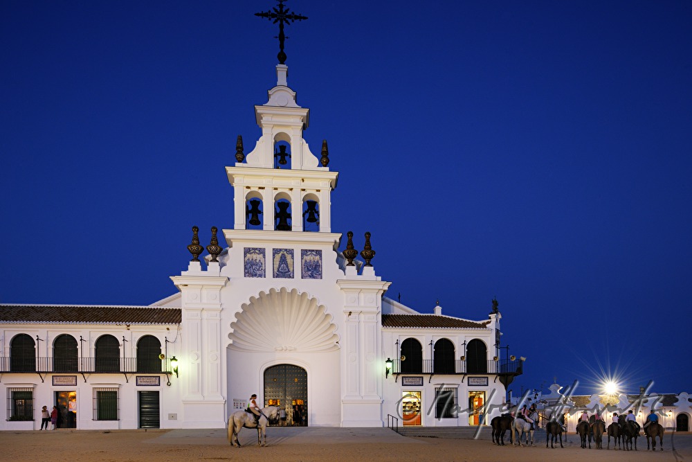 group of horseback riders in front of the pilgrimage church