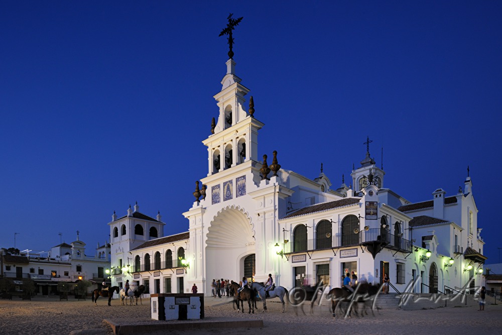 group of horseback riders in front of the pilgrimage church