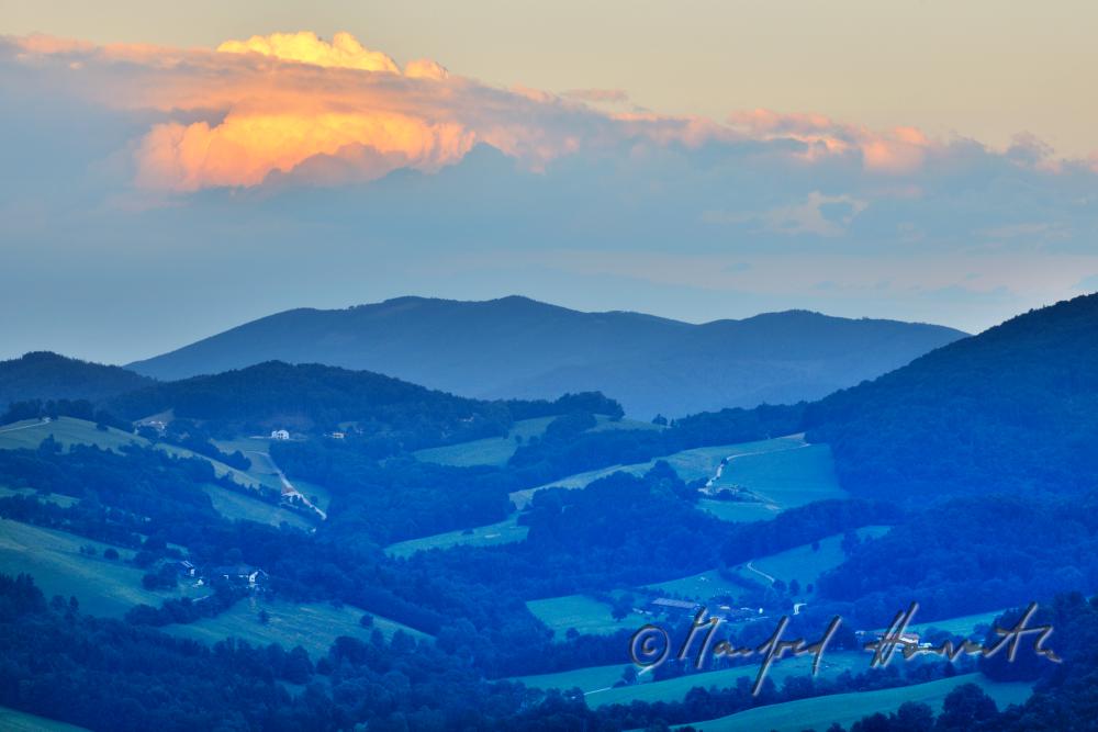 thunderclouds over the hills
