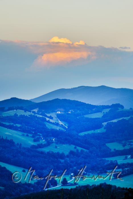 thunderclouds over the hills