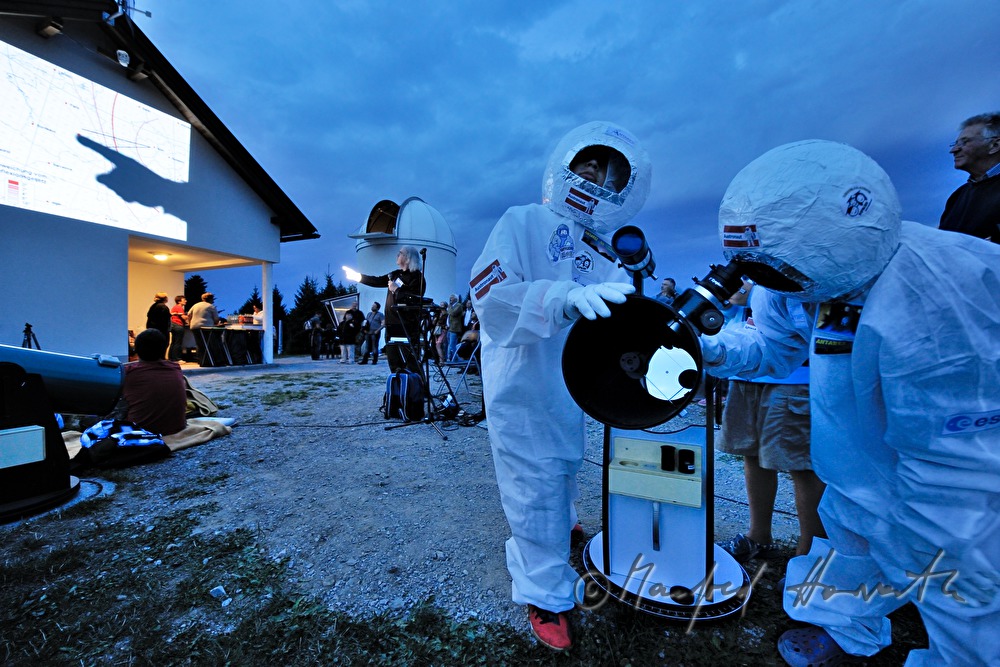 disguised kids working with the telescope
