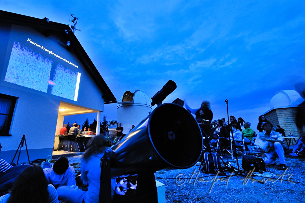 star watchers at a presentation near the observatory