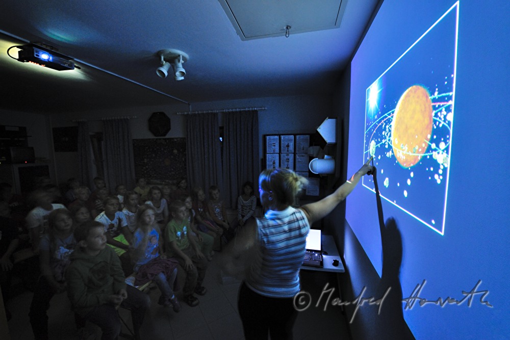 kids during a lession about astronomy