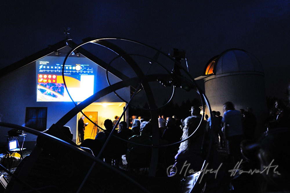 star watchers at a presentation near the observatory