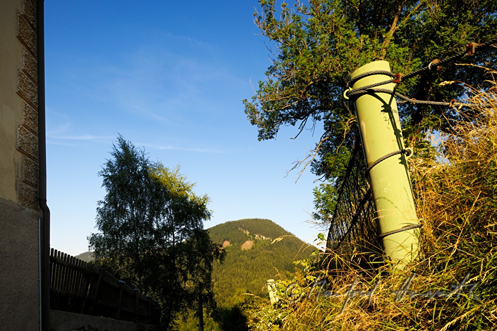 fence and mountain near the school