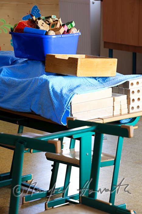covered toys on a school desk