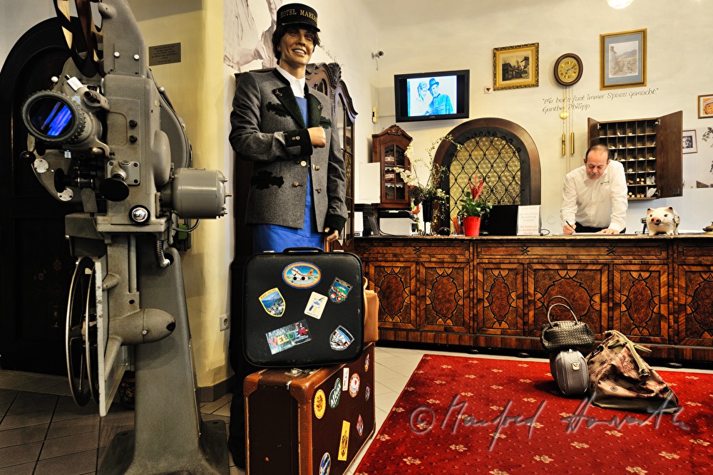 reception of Hotel Mariandl and a cinema projector