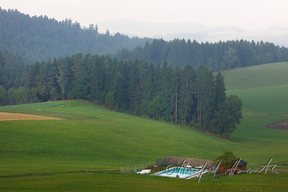 remote swimming pool in a field
