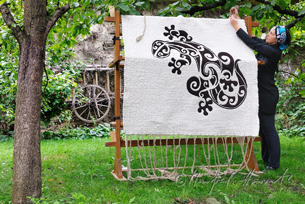 Barbara Schmidt with a wool carpet of hers