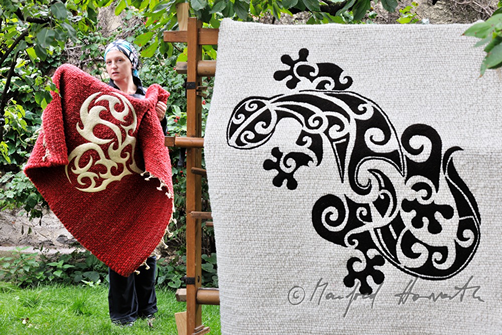 Barbara Schmidt with a wool carpet of hers