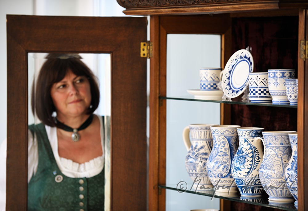 visitor looks at the pottery exhibits