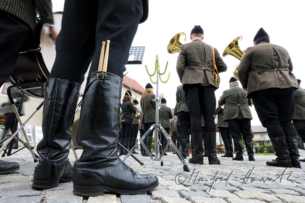 drummer of the folk music band keeps drumsticks in his boots
