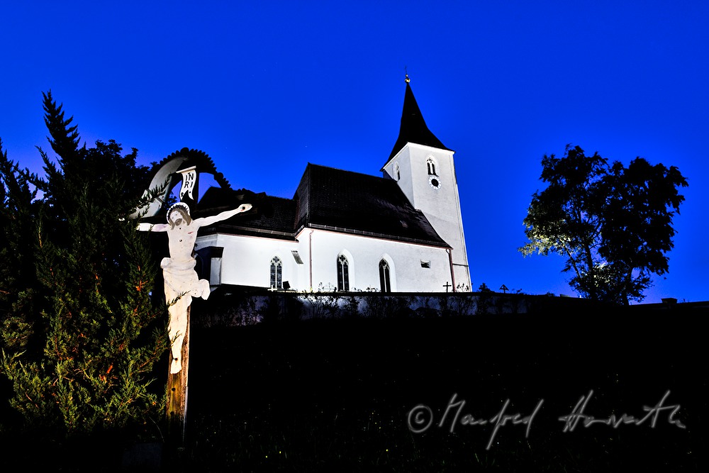 church and crucifix on the hill
