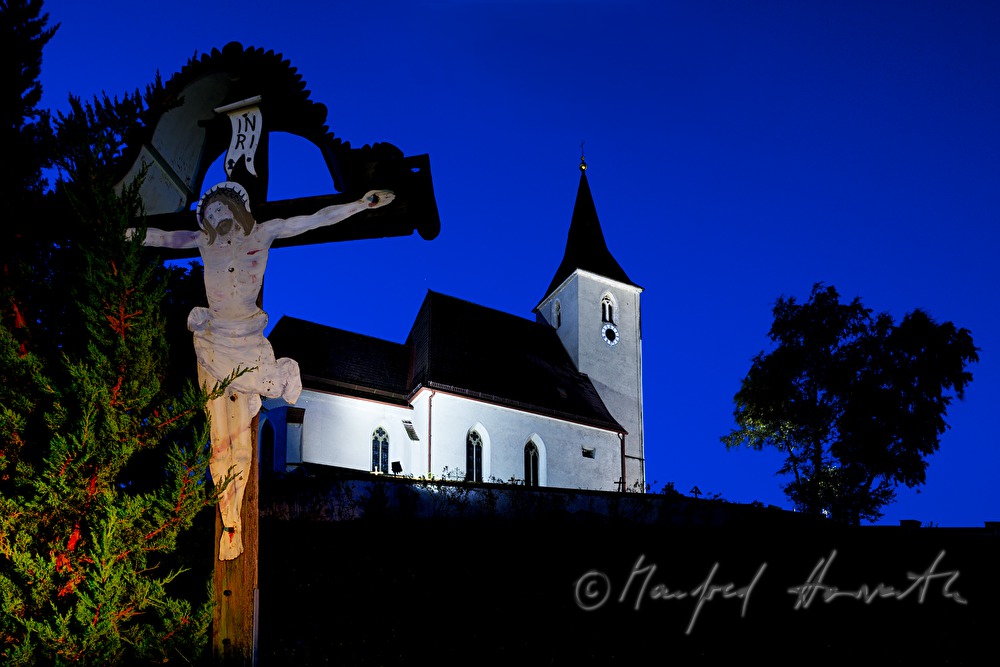 church and crucifix on the hill