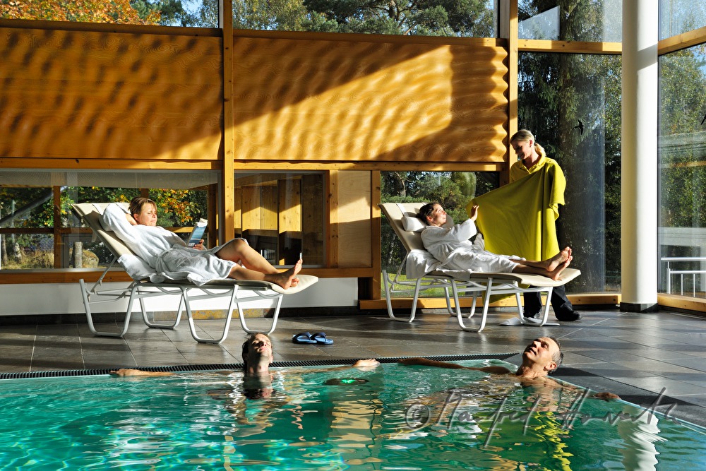 hotel guests relax in the pool