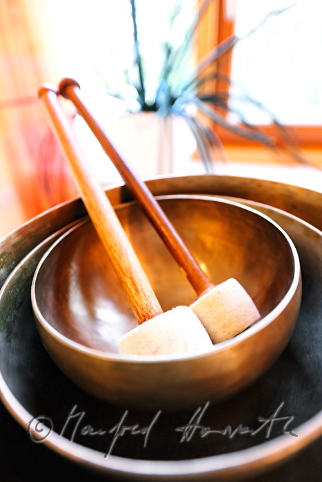 hotel guests in a theapy with Tibetan singing bowl