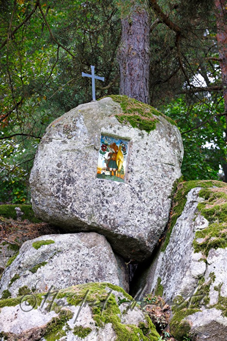 erratic boulders with a cross and Saint Florian
