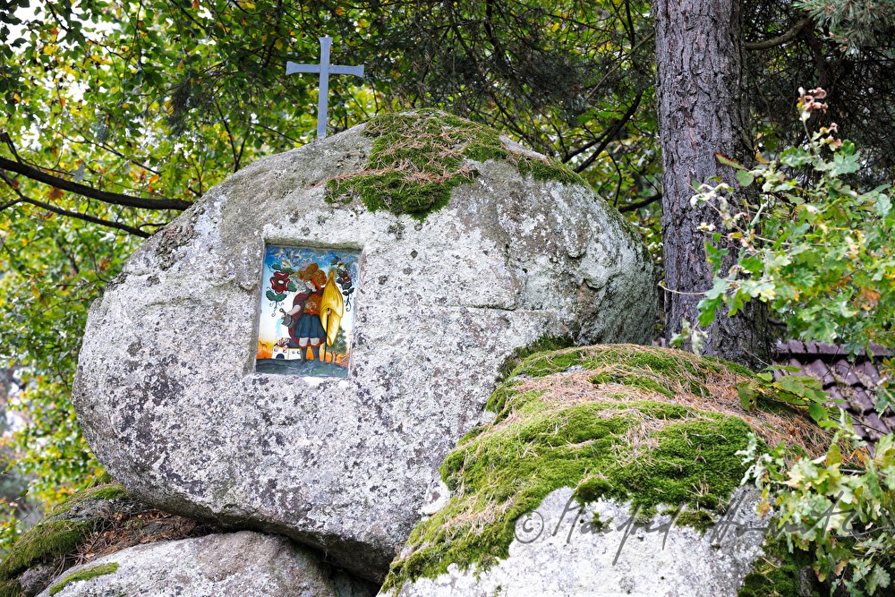 erratic boulders with a cross and Saint Florian