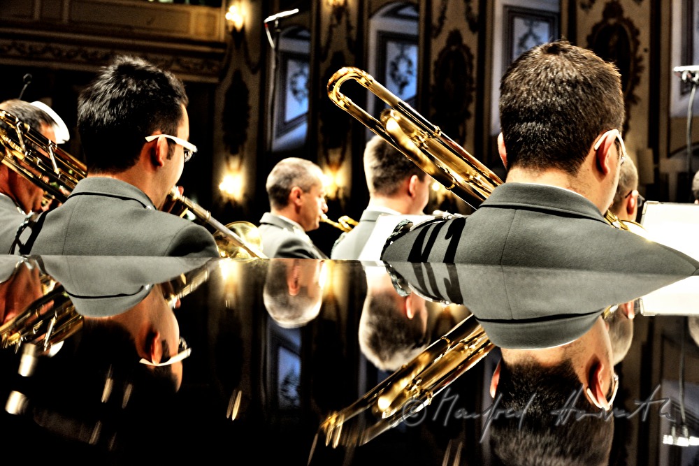 trombone players on stage  in concert
