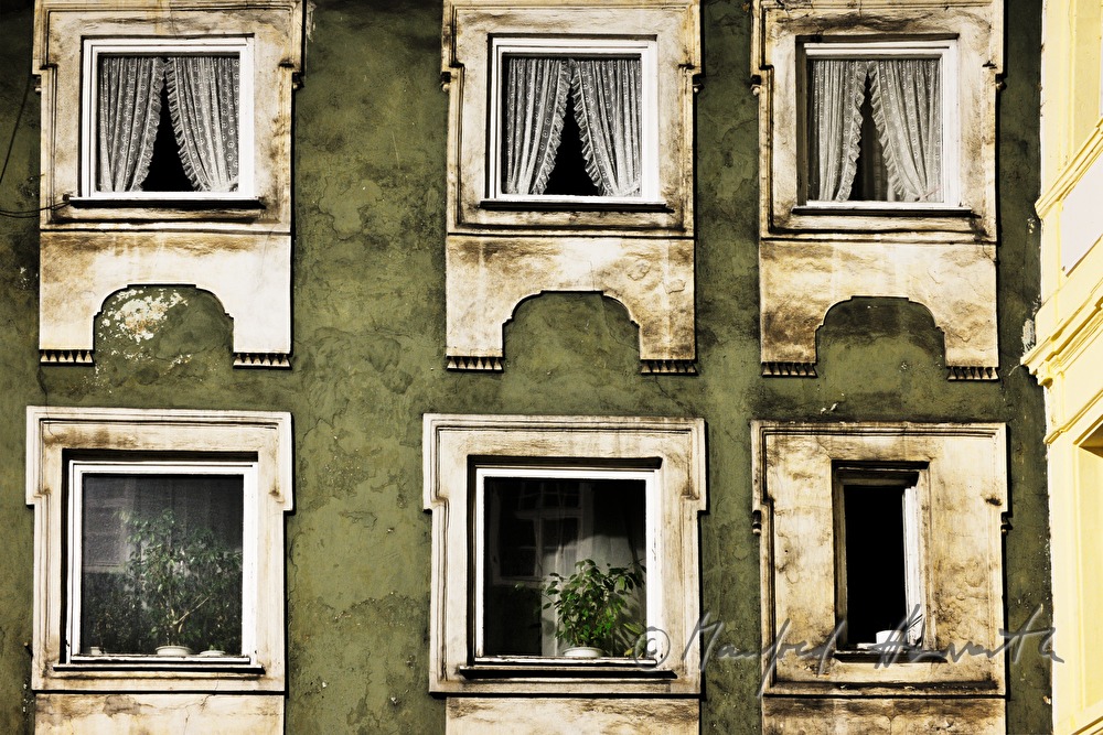 windows with curtains of a town house