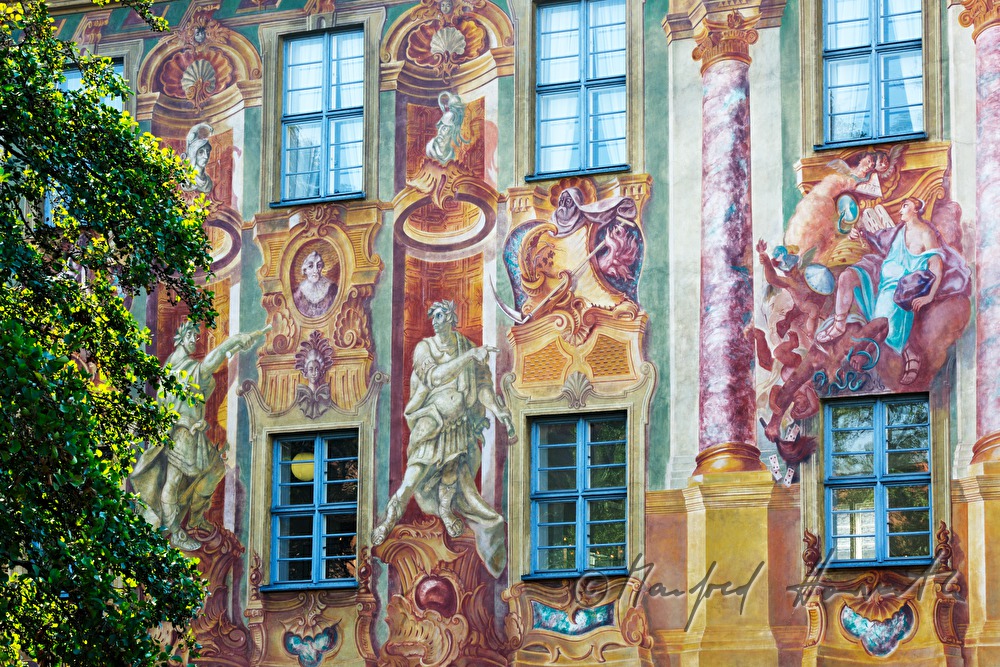 facade of the old town hall with a fresco