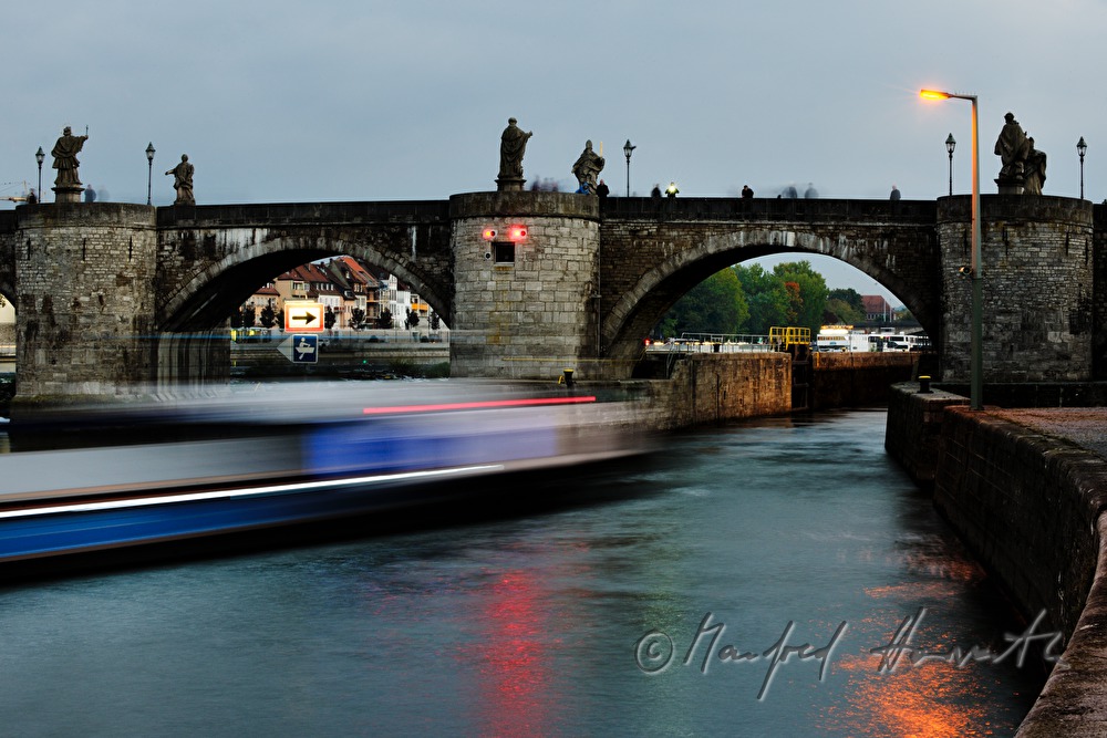 figures of saints on the old bridge over the river Main