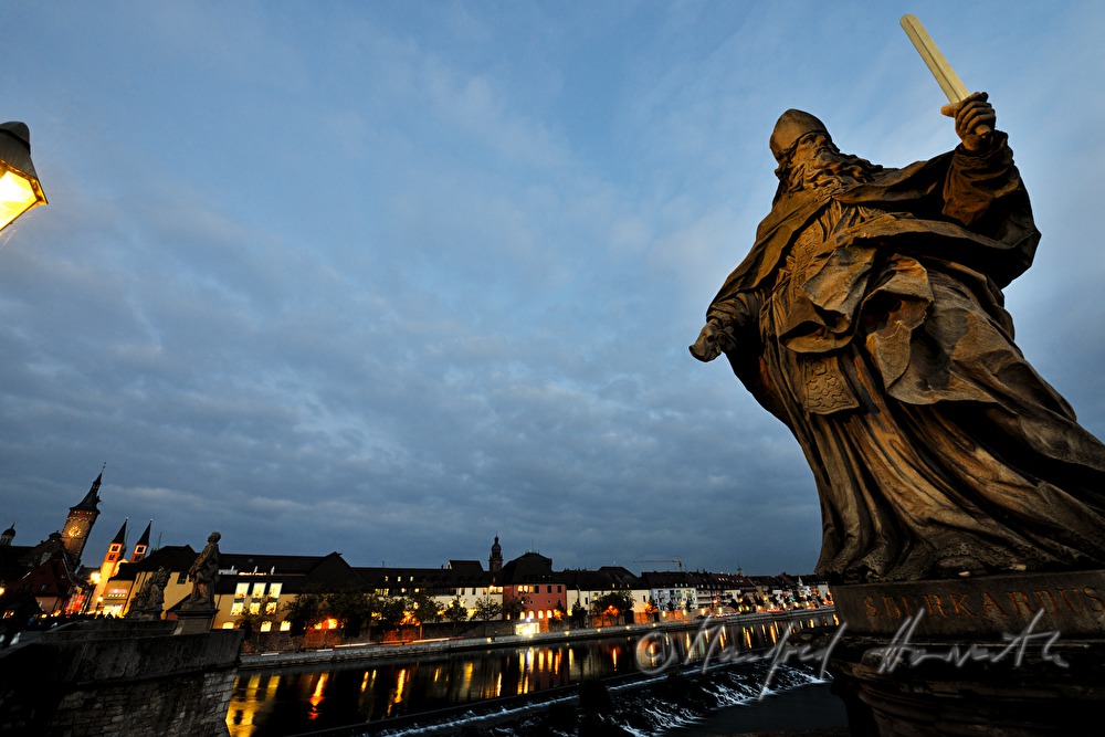 figures of saints on the old bridge over the river Main