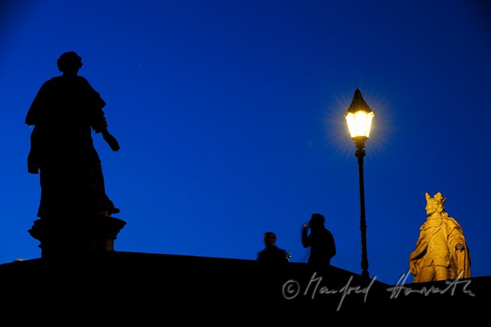 figures of saints on the old bridge over the river Main