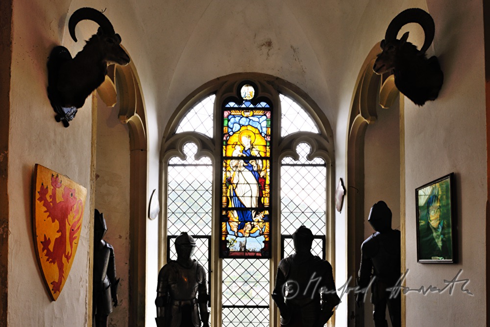armaments and crests in the foyer of Castle Rheinstein