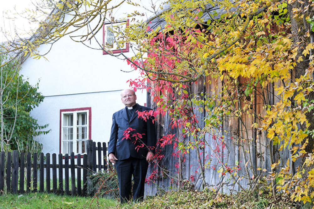 reverend Josef Kantusch in front of his parsonage