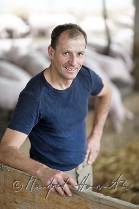 the farmer Franz Habel in his pigsty