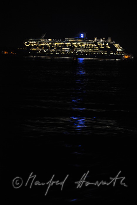 luxury cruiser anchoring in the harbour