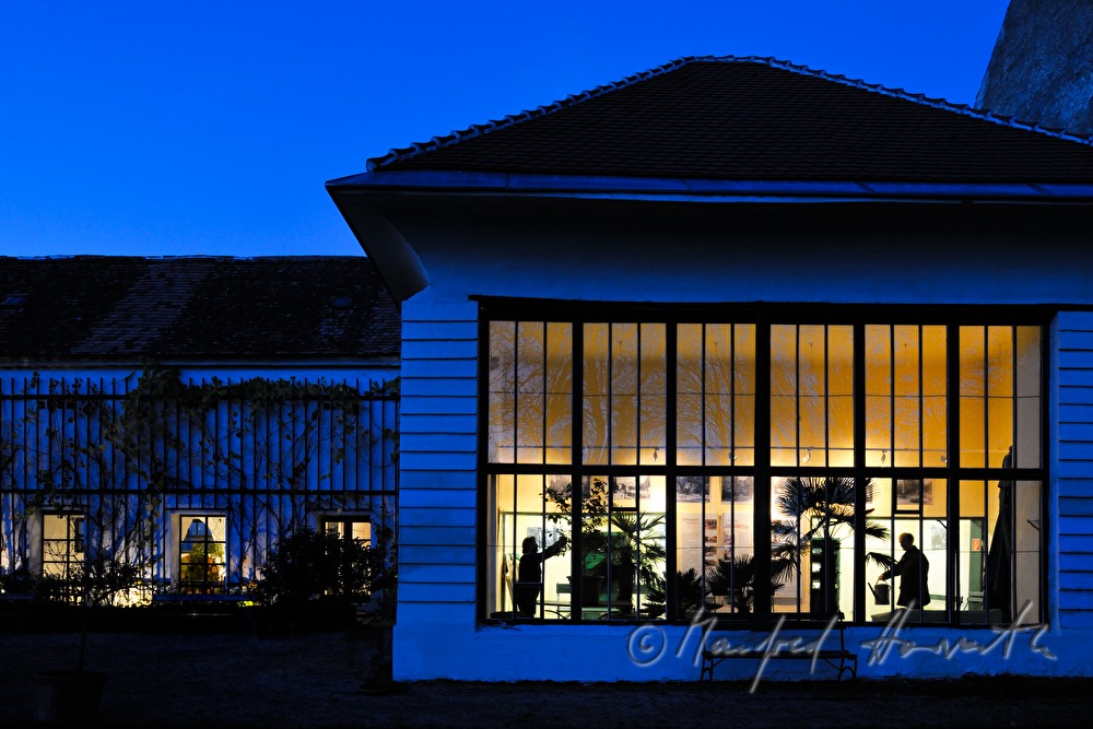 watering the plants in the orangery of Schloss Mühlbach