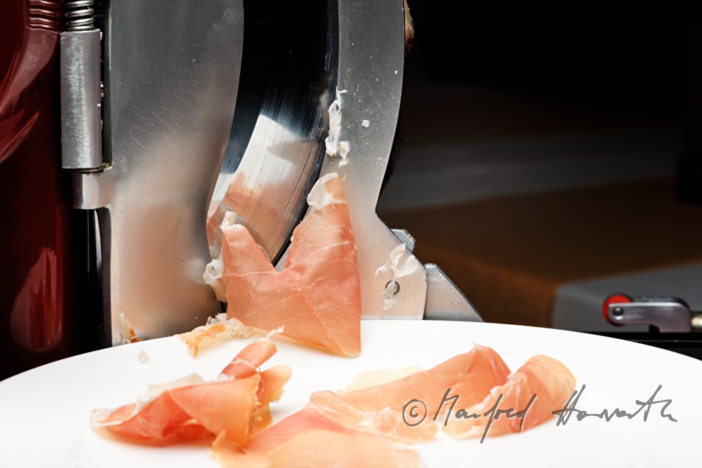 Vulcano Ham on the slicing machine in the restaurant