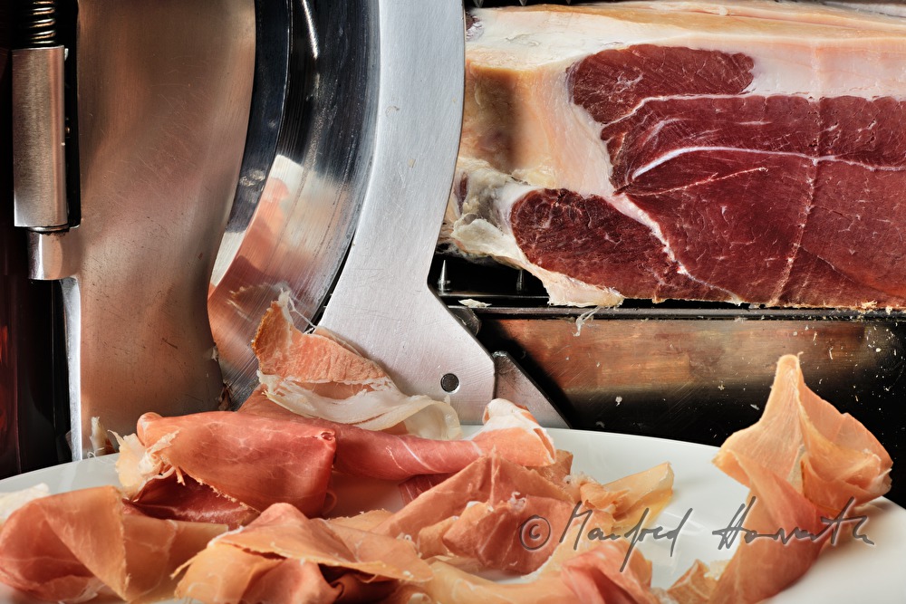 Vulcano Ham on the slicing machine in the restaurant