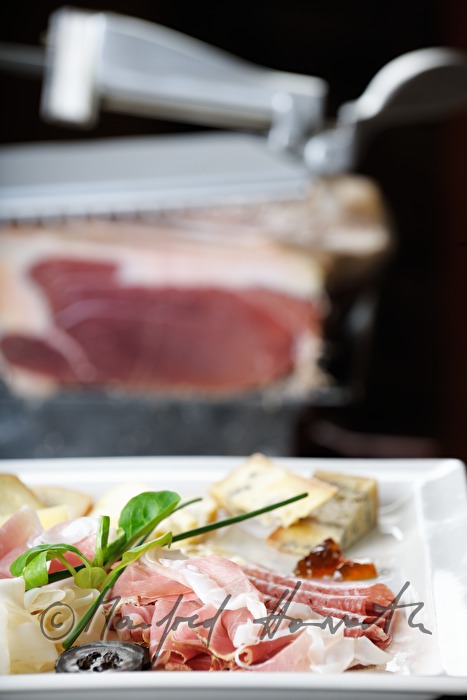 Vulcano Ham on the slicing machine in the restaurant
