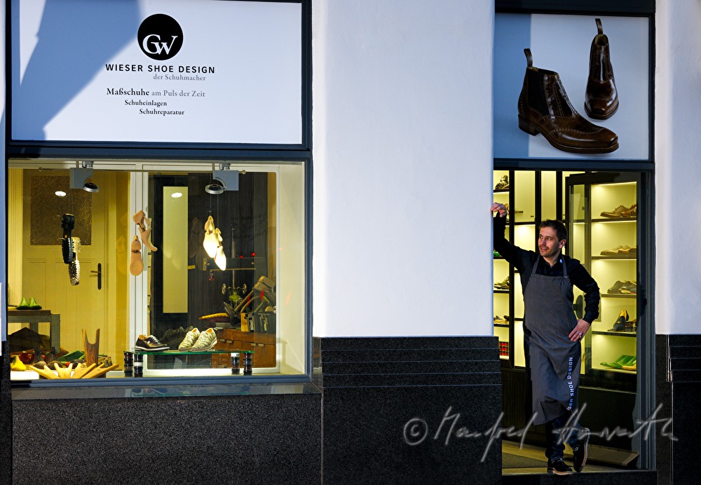 shoe maker Gerhard Wieser in front of his shop
