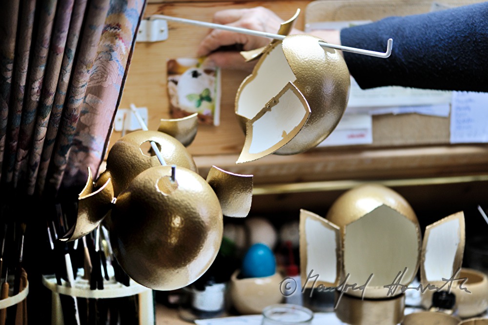 ostrich eggs painted in gold in the workshop