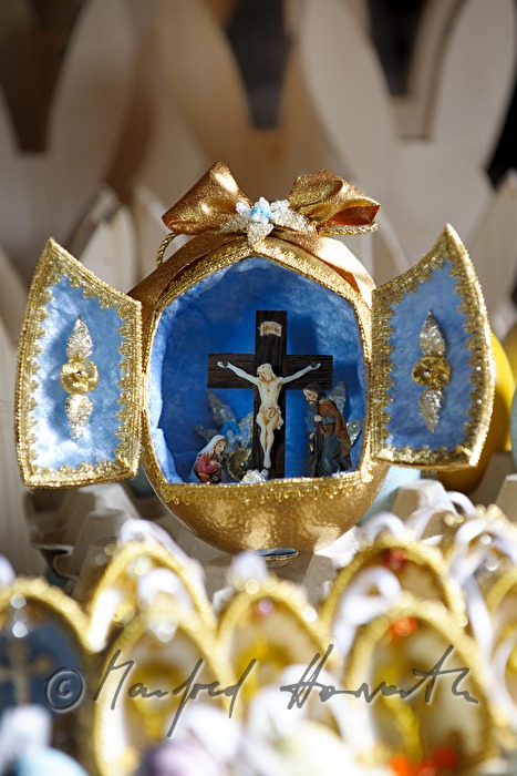 trimmed ostrich egg with a cross and gull-wing door