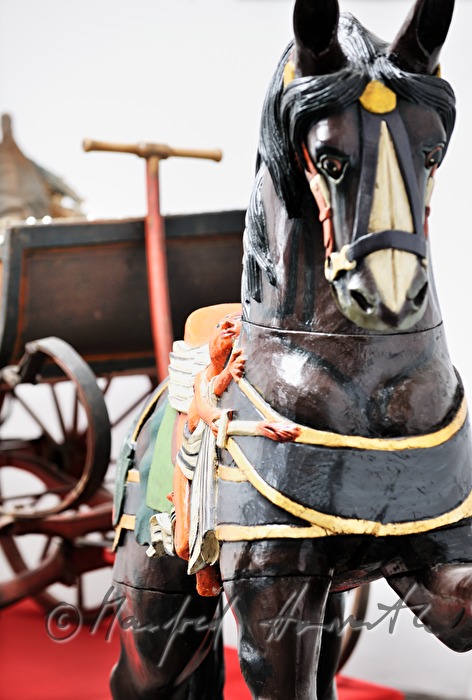 childrens carriage with a wooden horse
