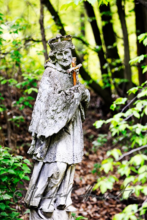 stone sculpture of Saint Nepumuk in the garden