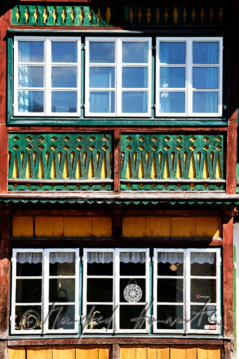 balcony with carved ballustrade made of wood