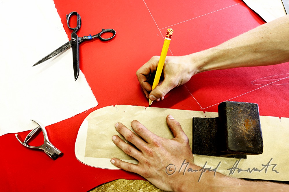cutting out the parts for a leather covering