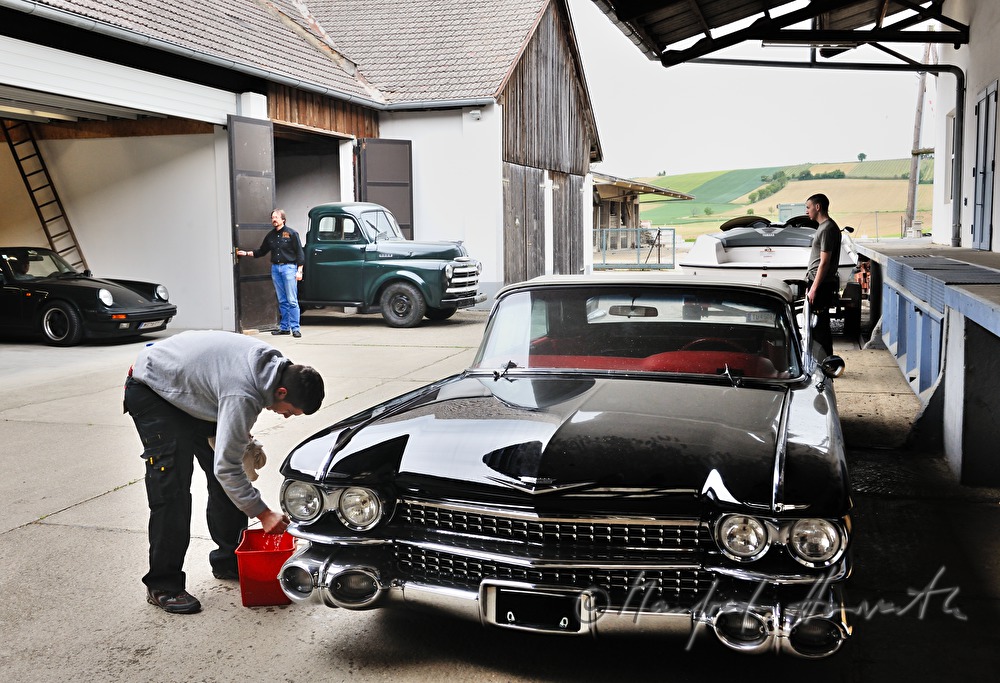 washing a Cadillac Eldorado 1959